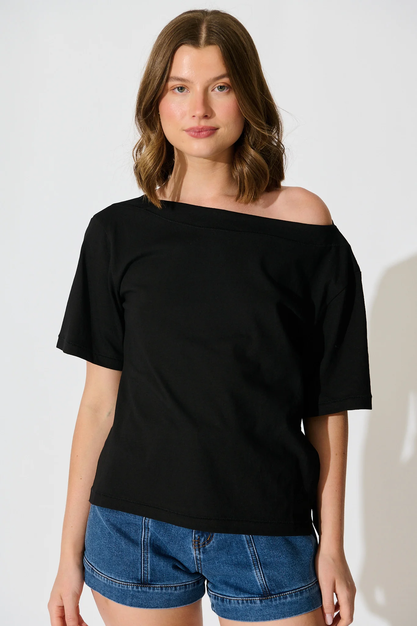 Aveda Off Shoulder T Shirt in Black