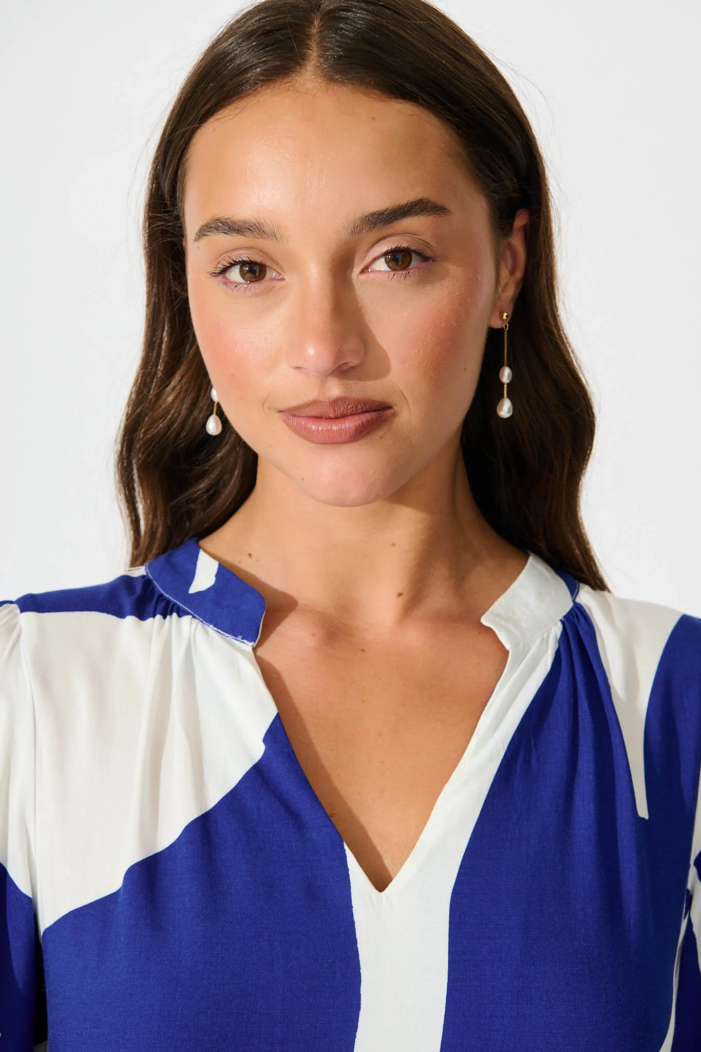 Dainty Drop Pearl Earrings in Gold - Image 2
